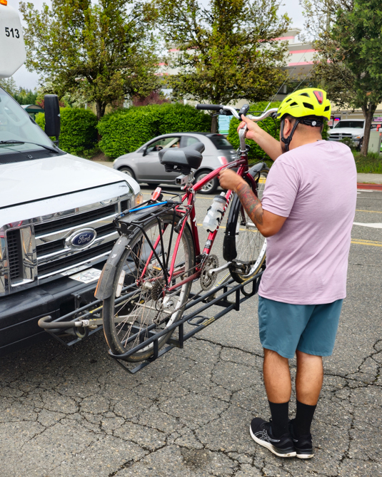 Rural transit rider mounting bike on shuttle